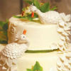 Love birds on a traditional white cake