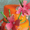Orange cake with pink flowers