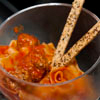 veal bolognese and fire roasted tomatoes
