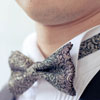Black and gold patterned bow tie
