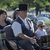 Coachman drives horse and carriage