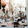 Twig centerpieces, wood chairs and high ceilings