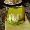 Green wedding décor with gold accents on menu