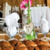 Rustic wedding theme with white table linens and pink flowers