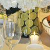 White floral centerpiece with halved limes for a touch of green