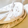 White ballet flats with bow and stiched detailing on toe