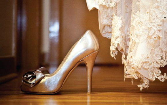 Metallic gold peep toe with rose bud detail on toe Metallic gold peep toe with rose bud detail on toe