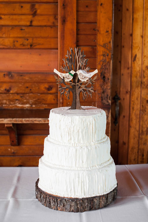 3 Tier White Cake With Rustic Detailing And Love Birds Topper 3 Tier White Cake With Rustic Detailing And Love Birds Topper