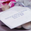 Thank you note on wedding favour with metallic lilac napkin