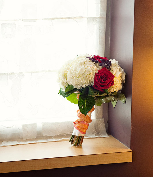 Colourful nosegay bouquet with red roses and white carnations Colourful nosegay bouquet with red roses and white carnations