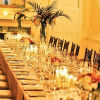 Elegant reception décor with orange & white table flowers