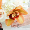 Fall-inspired bouquet with blush roses, white hydrangea and orange orchids