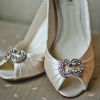 Metallic cream open toe pumps with silver and rhinestone detail on toe