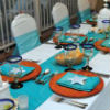 Island theme teal & white table linens, & unique white centerpieces