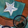 Island theme with teal & white table linens & place settings