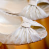 Cream peep toe wedge flats with gold metallic dusting and rouched toe