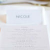 All white linens, place setting and floral centerpiece