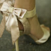 Champagne open toe sandals with feminine back ankle bow 