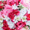 Bright summer bouquet with fuchsia, pink and white roses and jewel accents