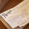 Rustic wood box holds "recipes" for a successful marriage from guests
