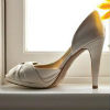 Metallic light gold peep toe pumps with rouched detail on the toe
