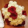 White rose bouquet with red rose accents