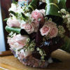 Pastel bouquet with white, light pink and light blue flowers and assorted greenery
