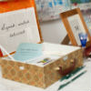 Vintage themed guest sign in table with good luck notes for the bride and groom.