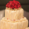 Ruched champagne fondant cake with red fondant roses and ruffles