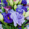 Garden bridal bouquet with blue, lavender, white and green flowers